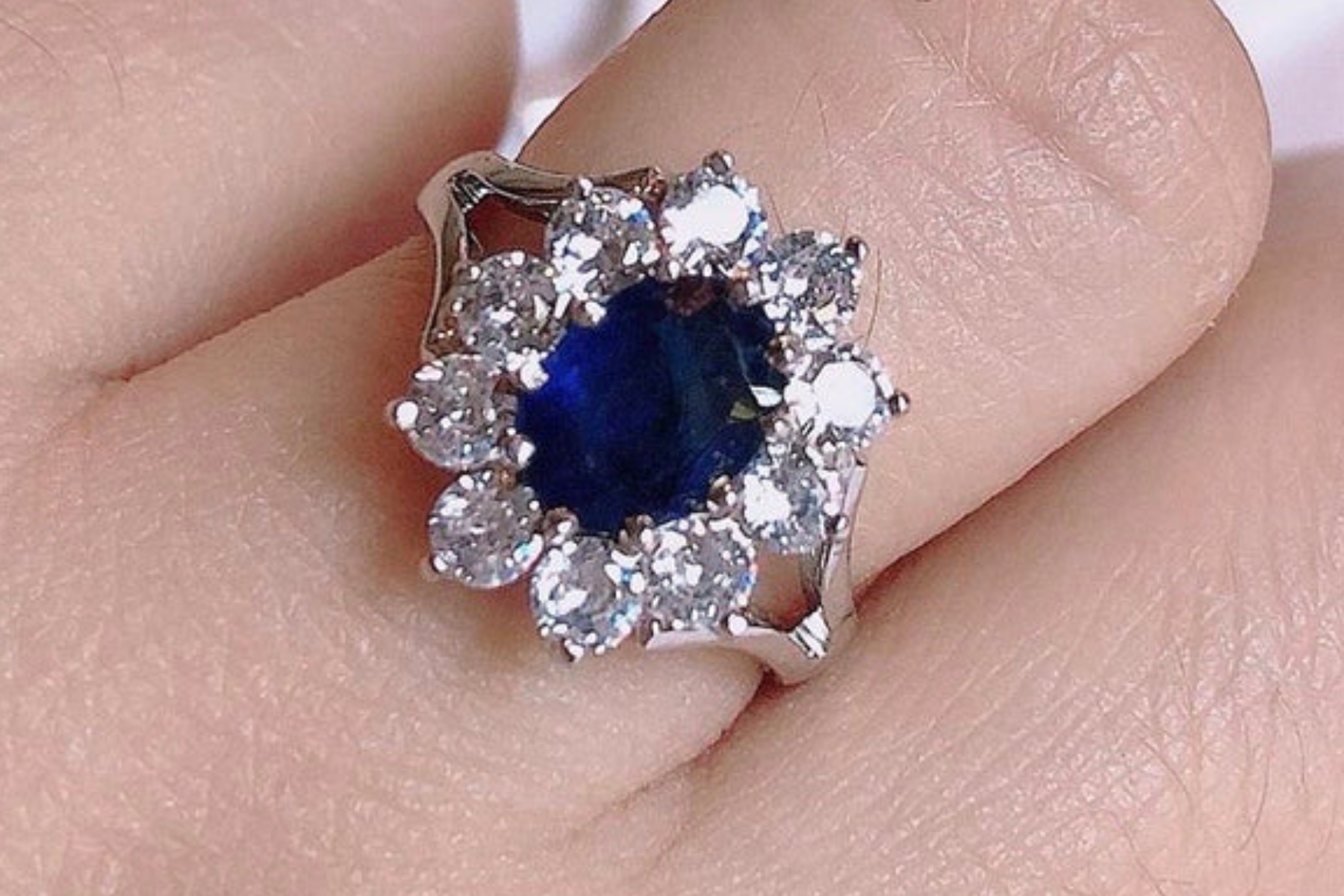 Sapphire ring on woman's finger