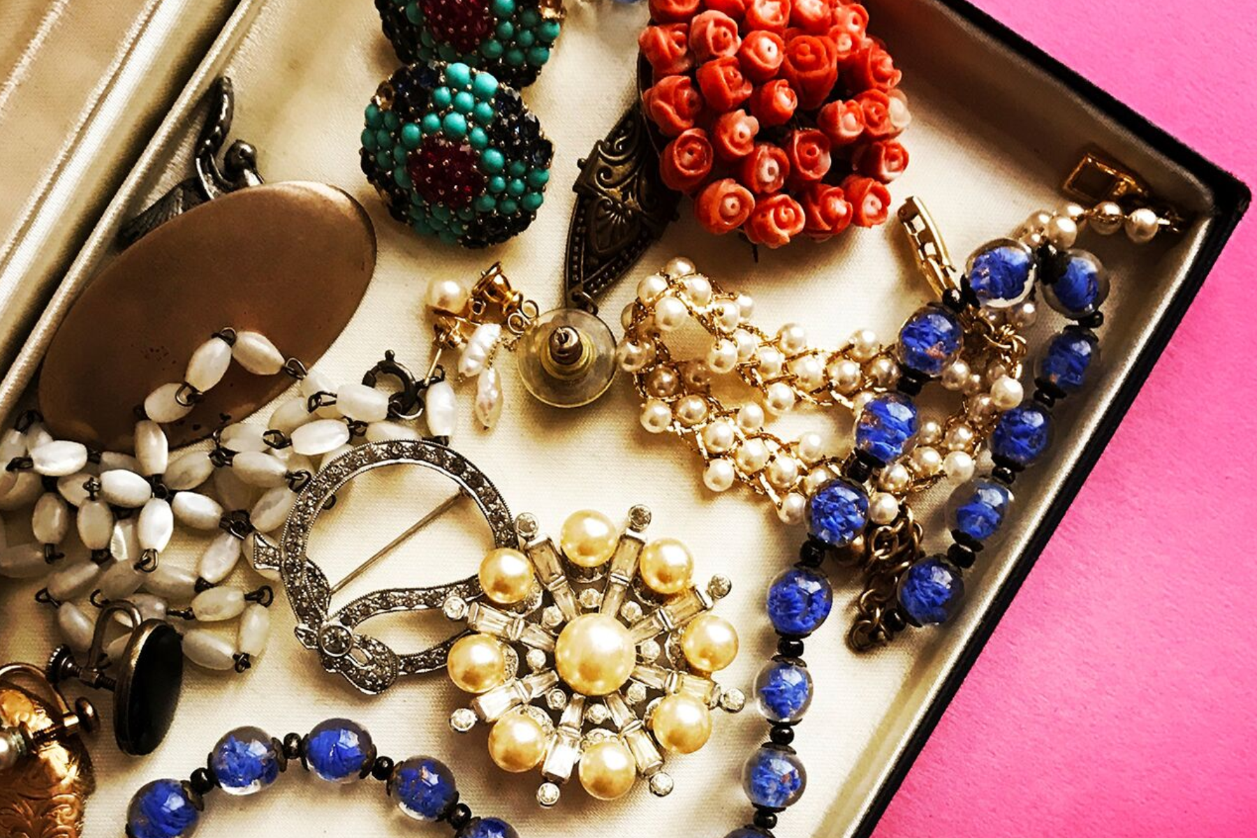 Mid-century vintage jewelry displayed on a box