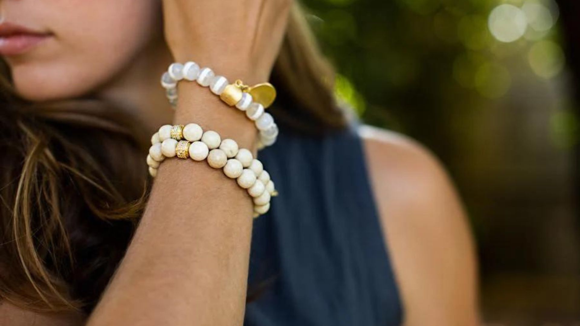 A Woman Wearing White Color Bracelets