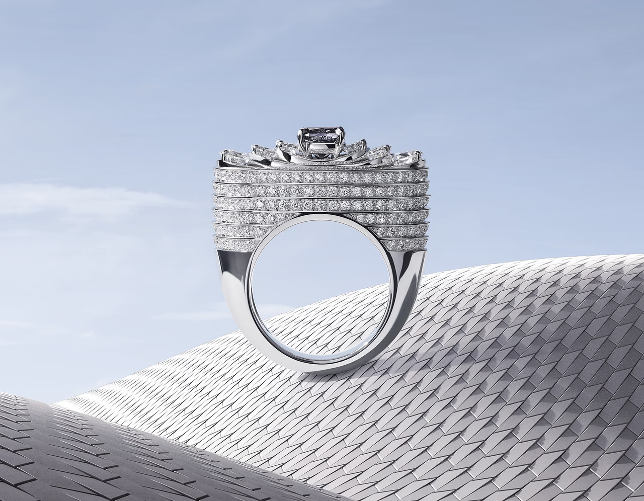 Cartier's Le Voyage Recommencé silver necklace with blue gem