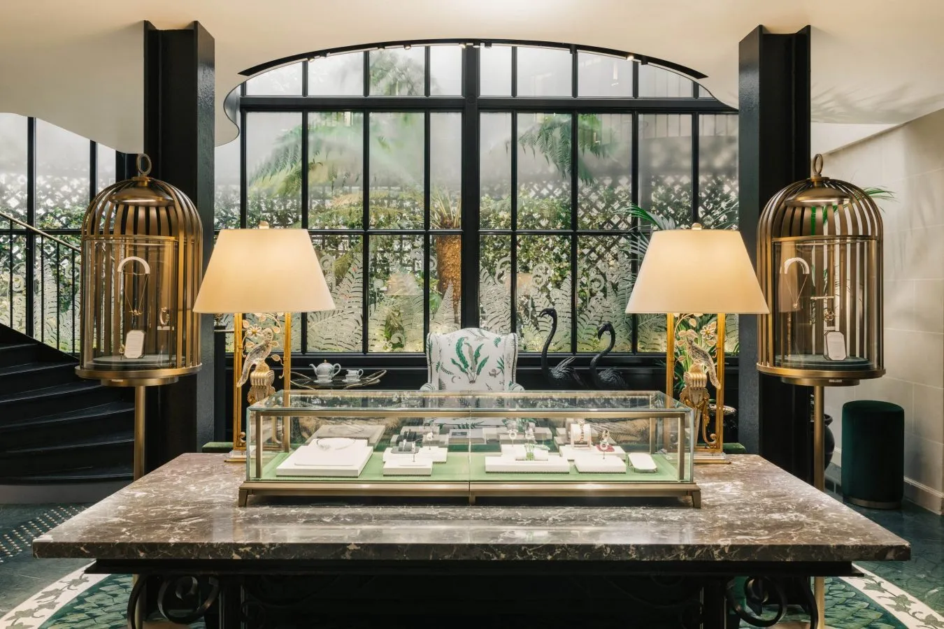 Elegant jewelry display inside lush winter garden interior